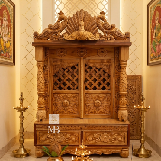 handcrafted wooden pooja mandir made from solid teak wood with storage drawer and carved doors.