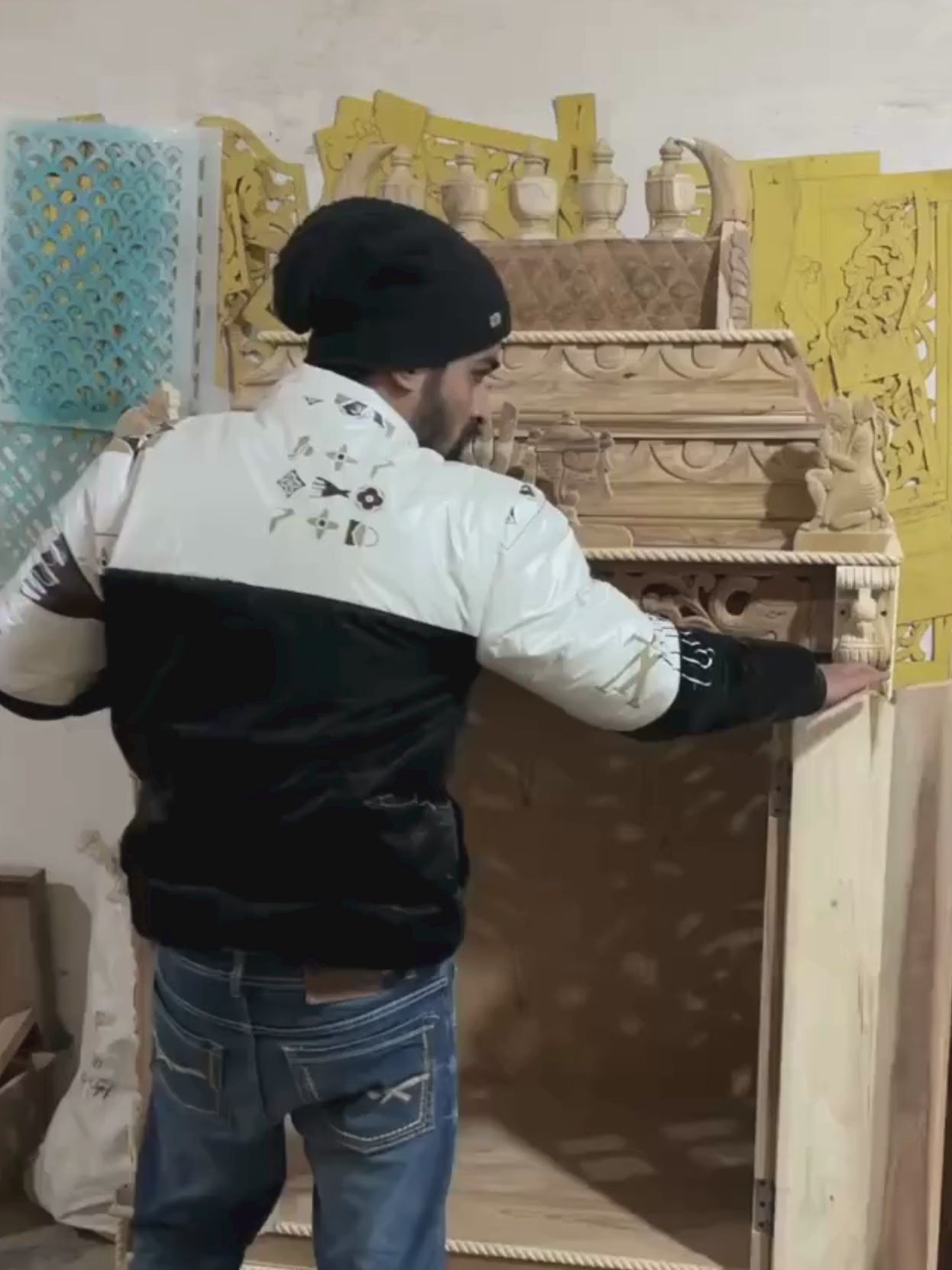 Hand carved wooden pooja mandir doors featuring multiple detailed devotional deity panels