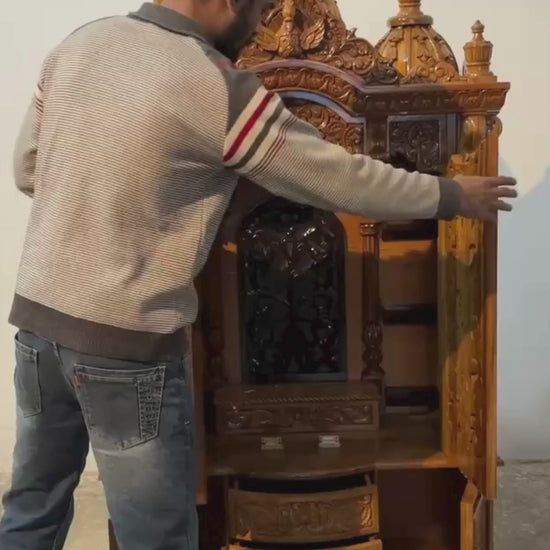 Hand carved wooden mandir for home with traditional shikhar and storage cabinet