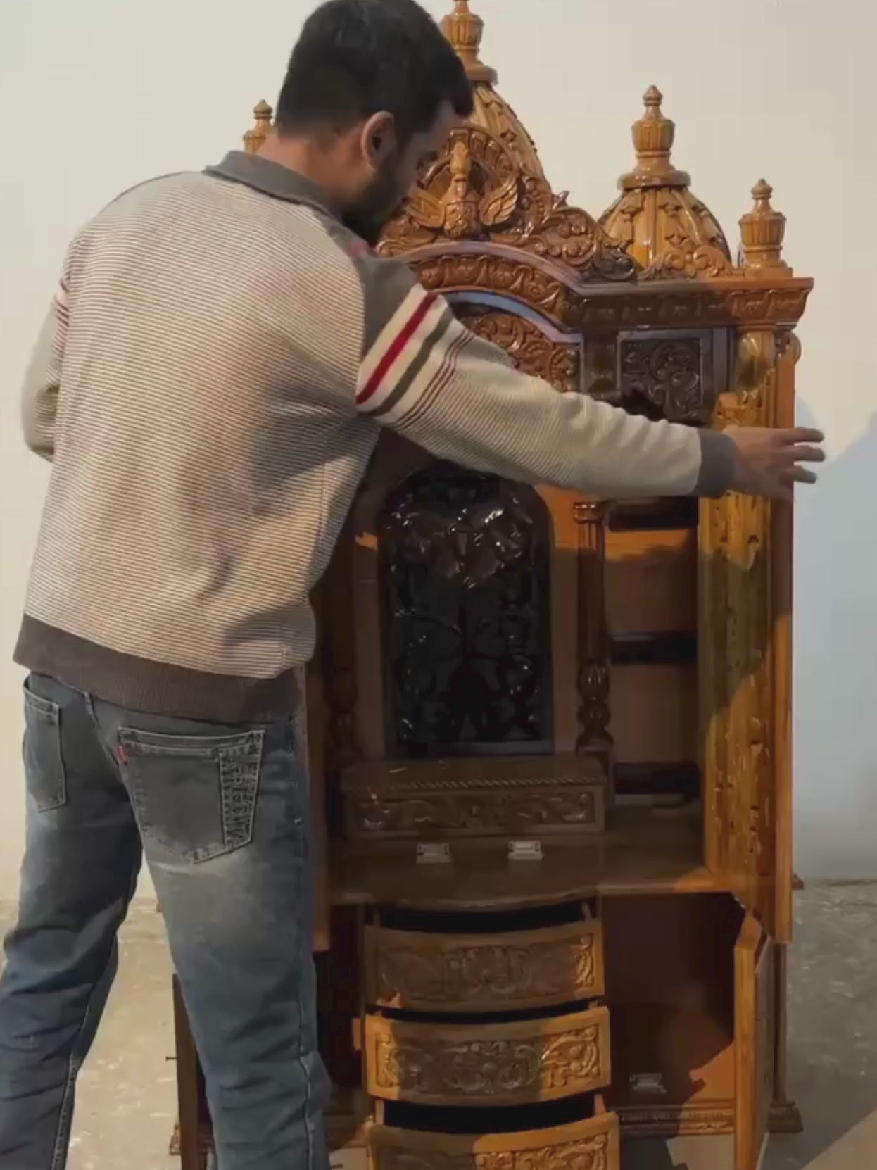 Hand carved wooden mandir for home with traditional shikhar and storage cabinet