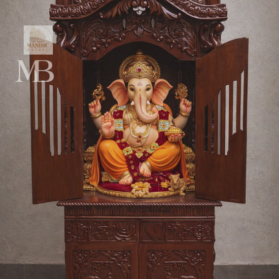 Hand carved wooden mandir for home with enclosed doors and storage cabinet