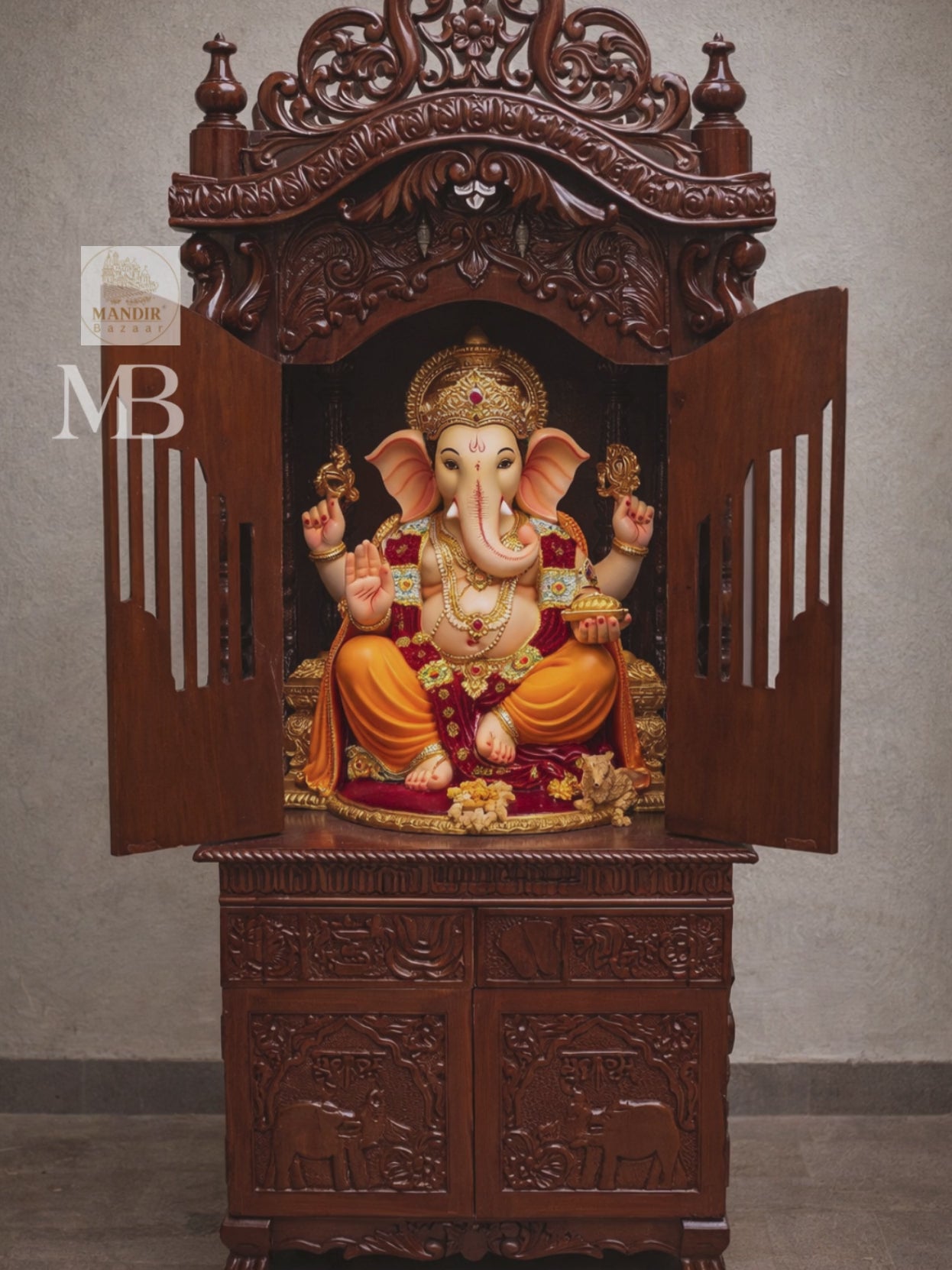 Hand carved wooden mandir for home with enclosed doors and storage cabinet