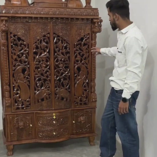 Spacious interior of enclosed wooden pooja mandir for home prayer