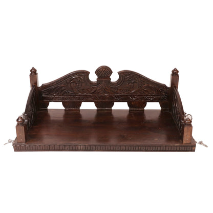 Ornate Rajasthani wooden swing with decorative craftsmanship