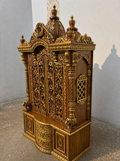 Side angle view showing side jali window, twisted pillars, and elephant base on Sheesham wooden temple