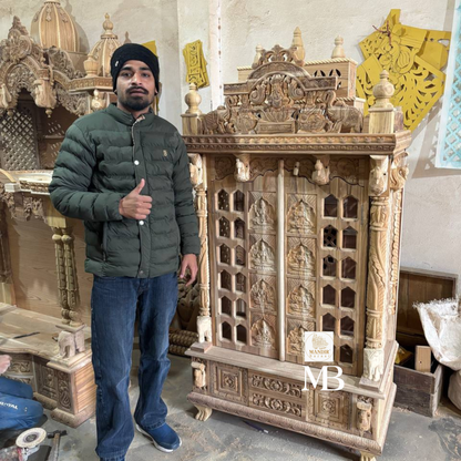 Feature callout graphic highlighting genuine brass bells, gold Ashtalakshmi carvings, and carved Om panel