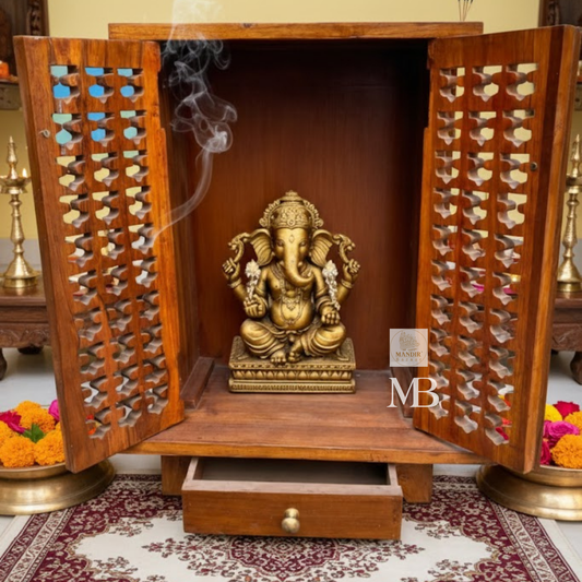 Front view of 32 inch compact Sheesham wood temple with closed carved lattice jali doors