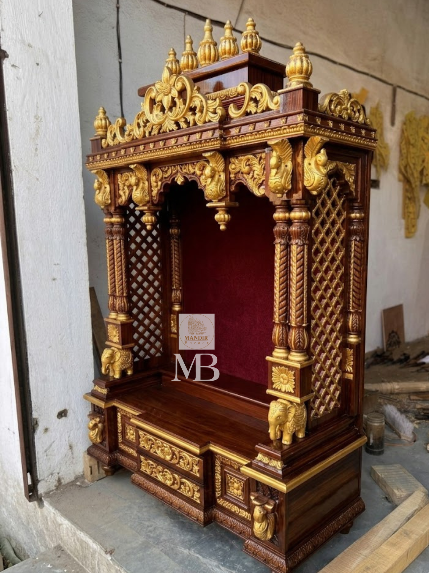 Three quarter angle of Sheesham wood home temple showing side lattice jali panels and gold crown