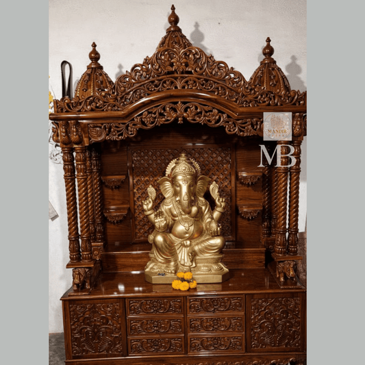 Hand carved Sheesham wood pooja mandir in walnut brown finish with storage drawers and decorative pillars