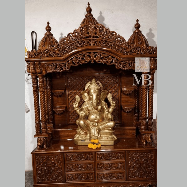 Hand carved Sheesham wood pooja mandir in walnut brown finish with storage drawers and decorative pillars