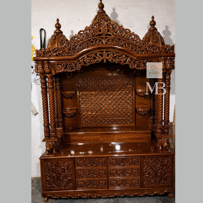 Hand carved Sheesham wood pooja mandir in walnut brown finish with storage drawers and decorative pillars