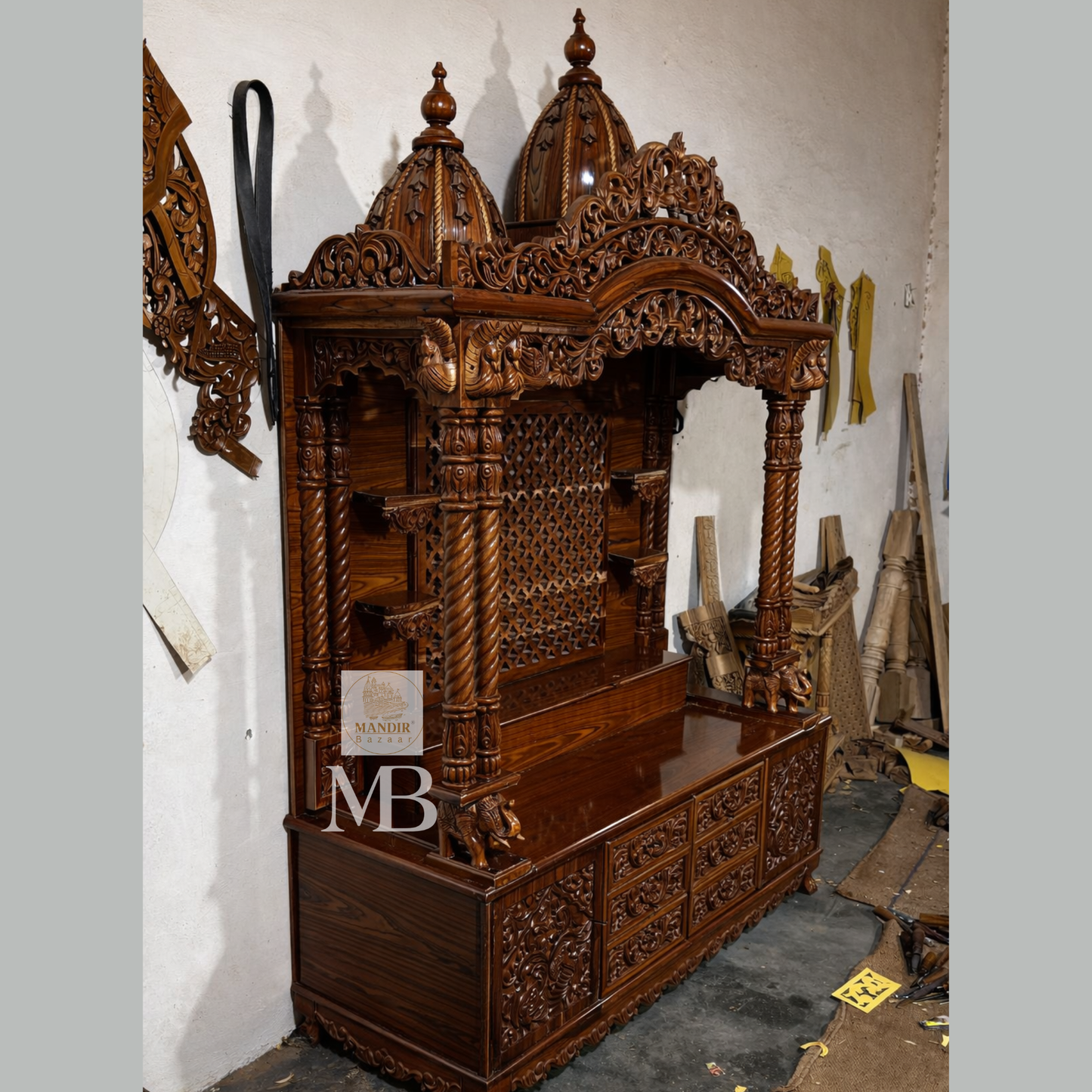 Hand carved Sheesham wood pooja mandir in walnut brown finish with storage drawers and decorative pillars