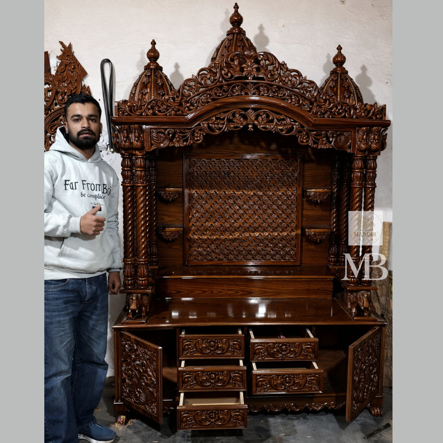 Sheesham wood home temple design showing carved pillars, jaali back panel, storage drawers and side cabinets