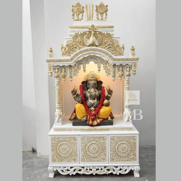 6 feet Sheesham wood pooja mandir in white and gold with hand carved details and storage drawers