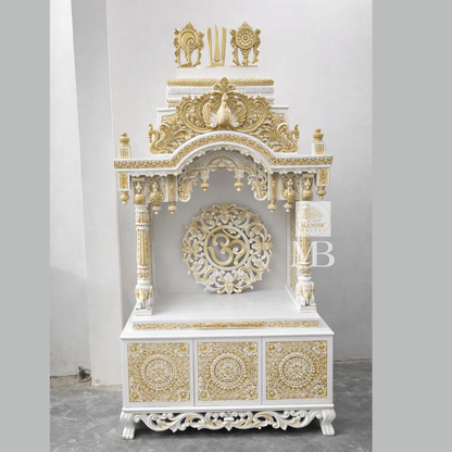 6 feet Sheesham wood pooja mandir in white and gold with hand carved details and storage drawers