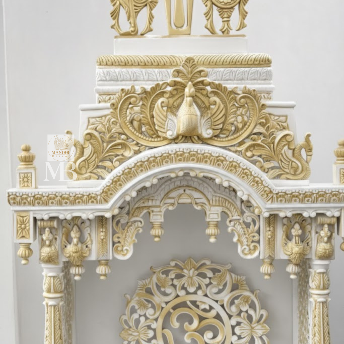 6 feet Sheesham wood pooja mandir in white and gold with hand carved details and storage drawers