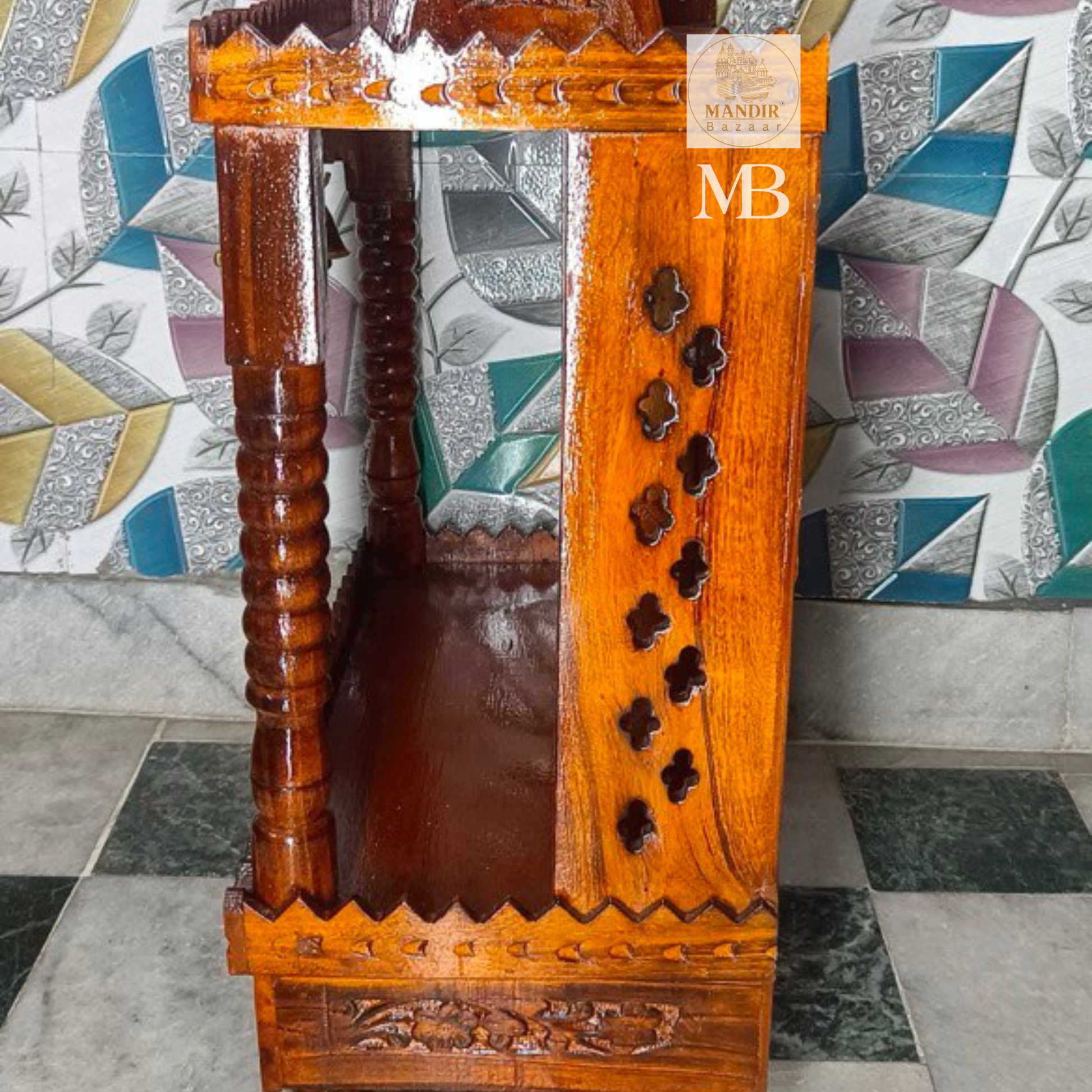 Side profile view of Sheesham wood mandir showing clover trefoil side cutouts and turned pillar design