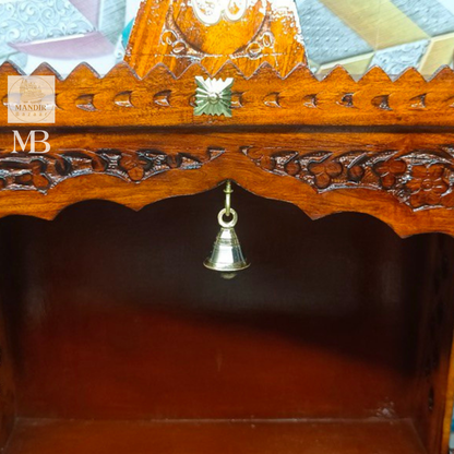 Front view of 21 inch handcrafted Sheesham wood home temple with pyramid shikhar, Om symbol, and hanging brass bell