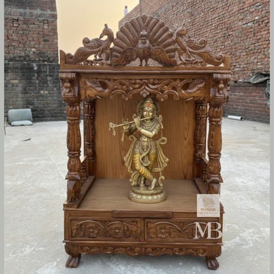Front view of 21 inch handcrafted Sheesham wood open temple with dancing peacock crest and elephant pillars