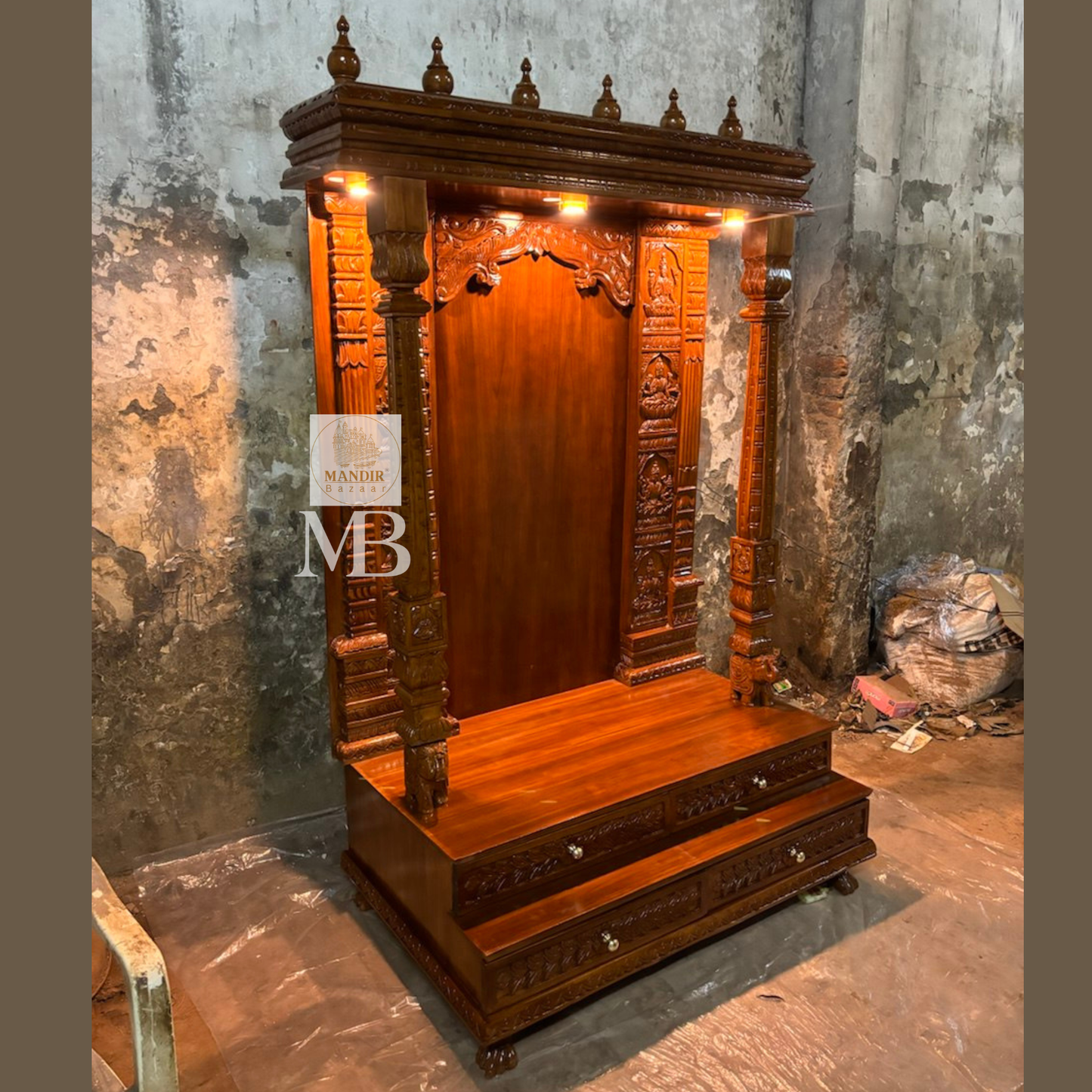 Side perspective angle of 6ft Sheesham wood temple highlighting 24 inch depth and elephant pillar bases