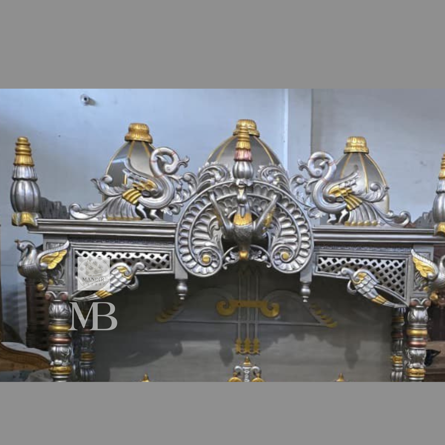 Luxury silver and gold hand carved wooden pooja mandir with ornate crown, decorative pillars, storage drawers and matching side cabinets