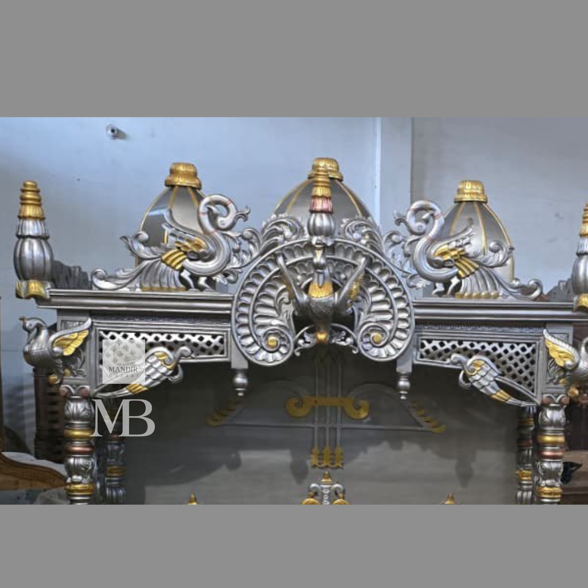 Luxury silver and gold hand carved wooden pooja mandir with ornate crown, decorative pillars, storage drawers and matching side cabinets