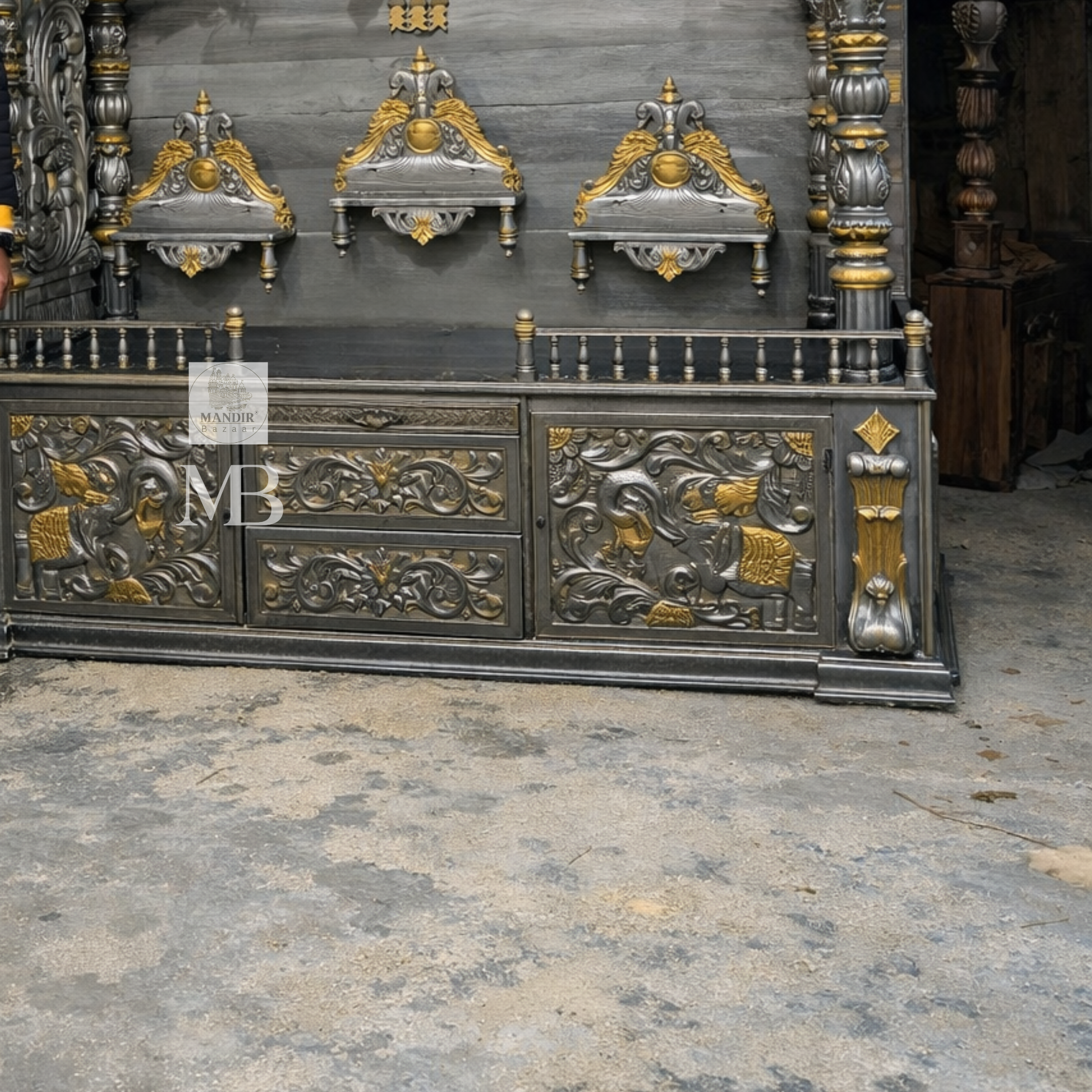 Luxury silver and gold hand carved wooden pooja mandir with ornate crown, decorative pillars, storage drawers and matching side cabinets