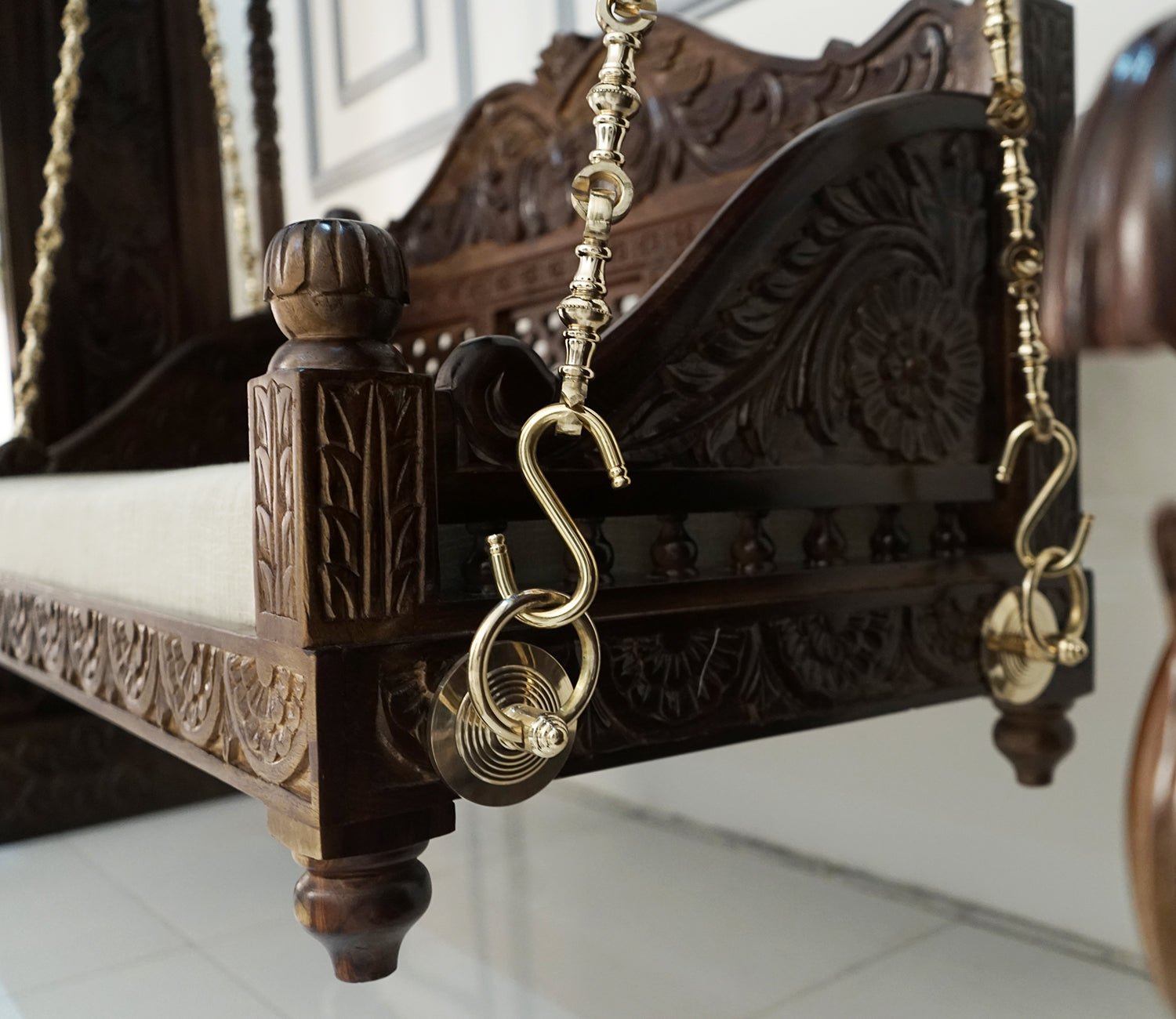 Classic wooden swing chair with supportive backrest and armrests