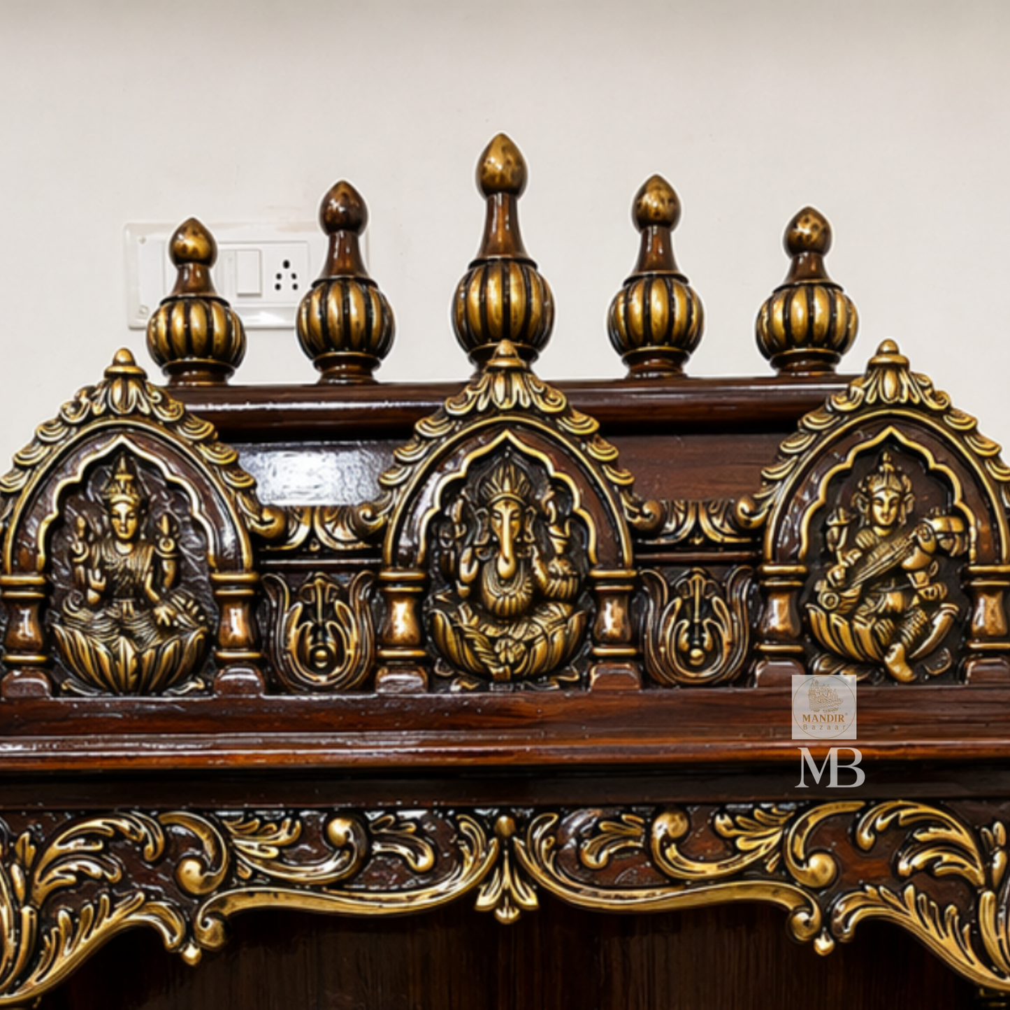 teak wood pooja mandir with hand carved details and storage drawers