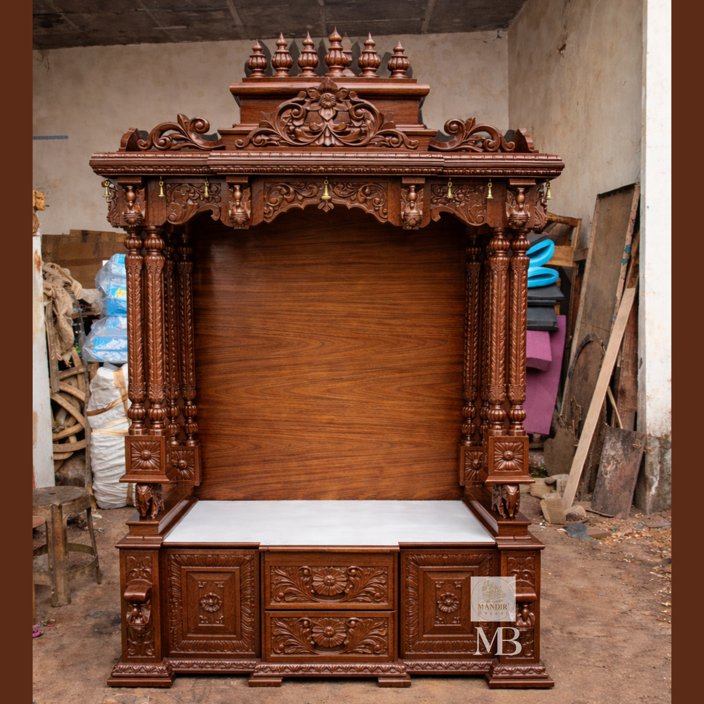 Traditional carved wooden mandir with decorative temple crown