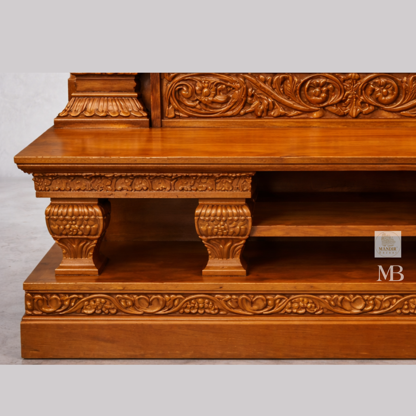 Ornate wooden mandir featuring decorative pillars and traditional Indian temple design
