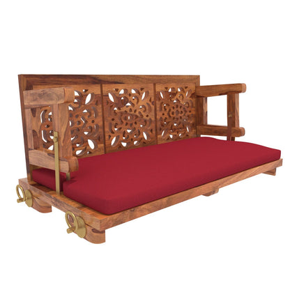 Carved back wooden jhula with red cushion upholstery