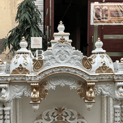 White and gold hand carved wooden mandir for home with Om design and storage cabinet