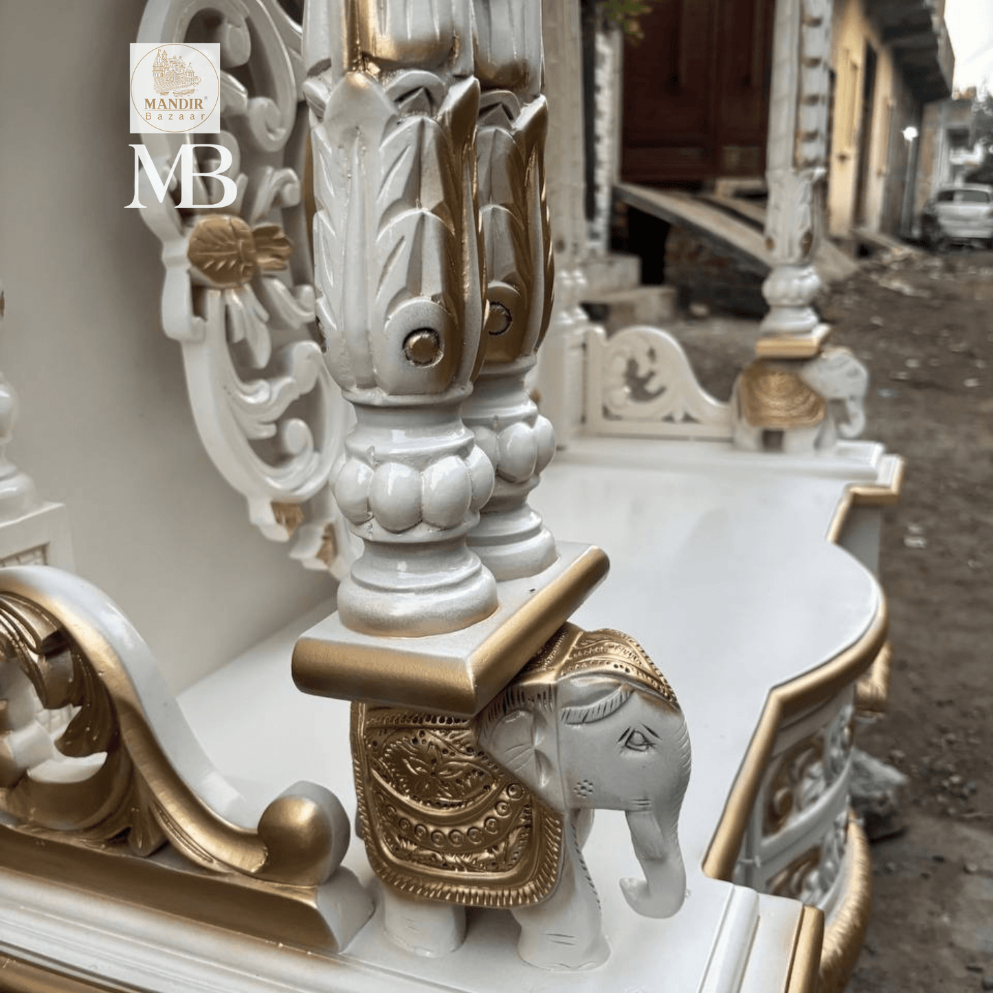 White and gold hand carved wooden mandir for home with Om design and storage cabinet