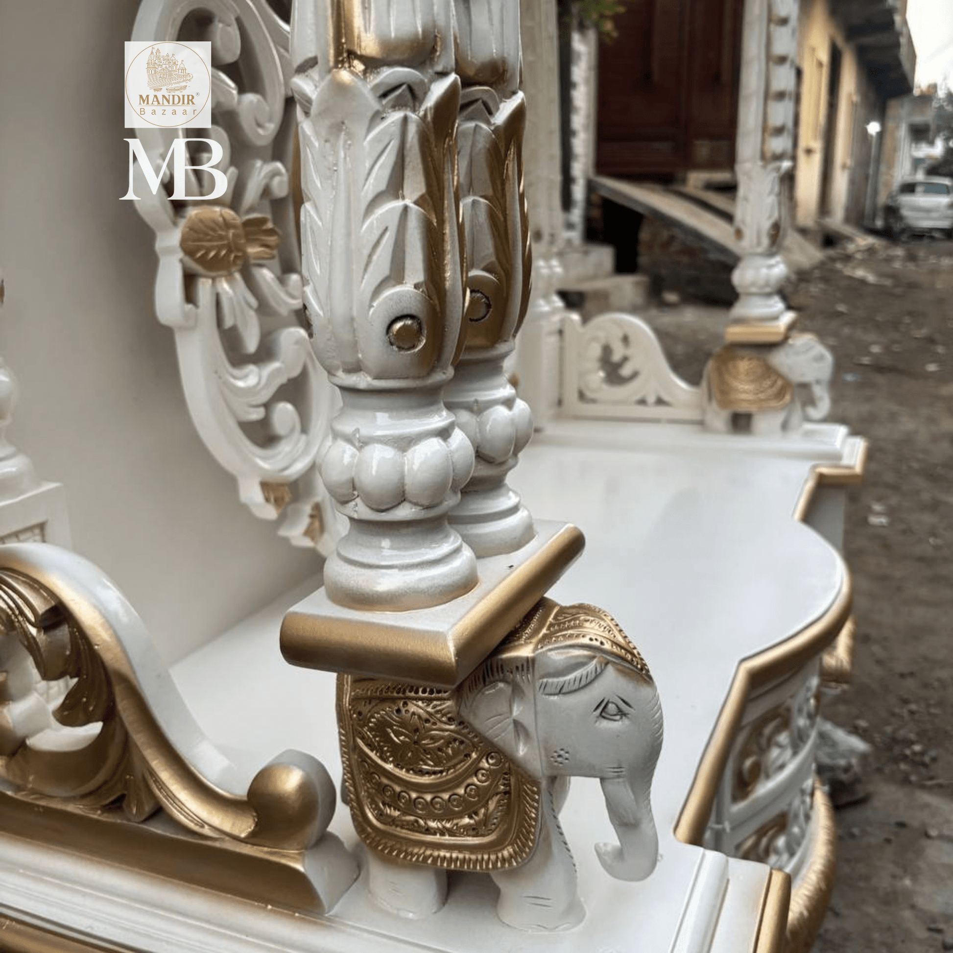 White and gold hand carved wooden mandir for home with Om design and storage cabinet