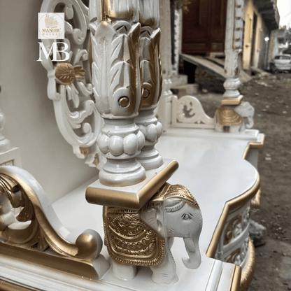White and gold hand carved wooden mandir for home with Om design and storage cabinet