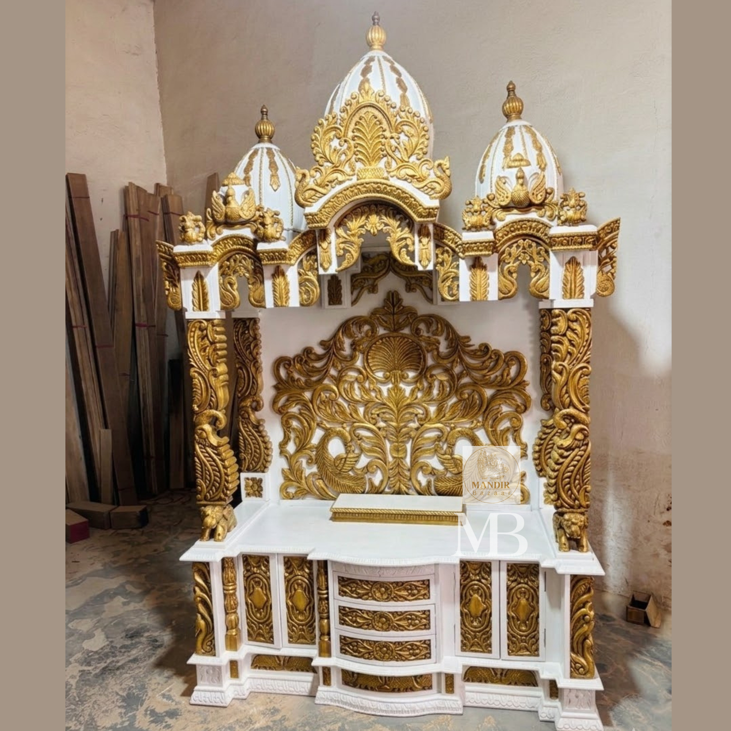 Hand carved wooden mandir with detailed gold decorative artwork