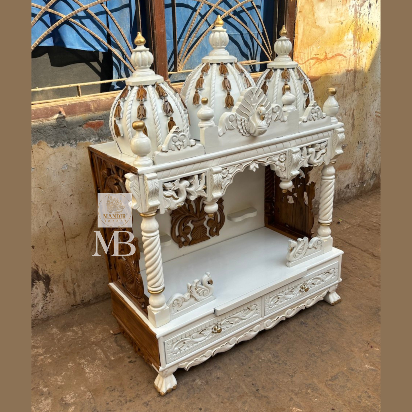 Detailed carved swan motifs and storage drawers with floral patterns on white wooden temple