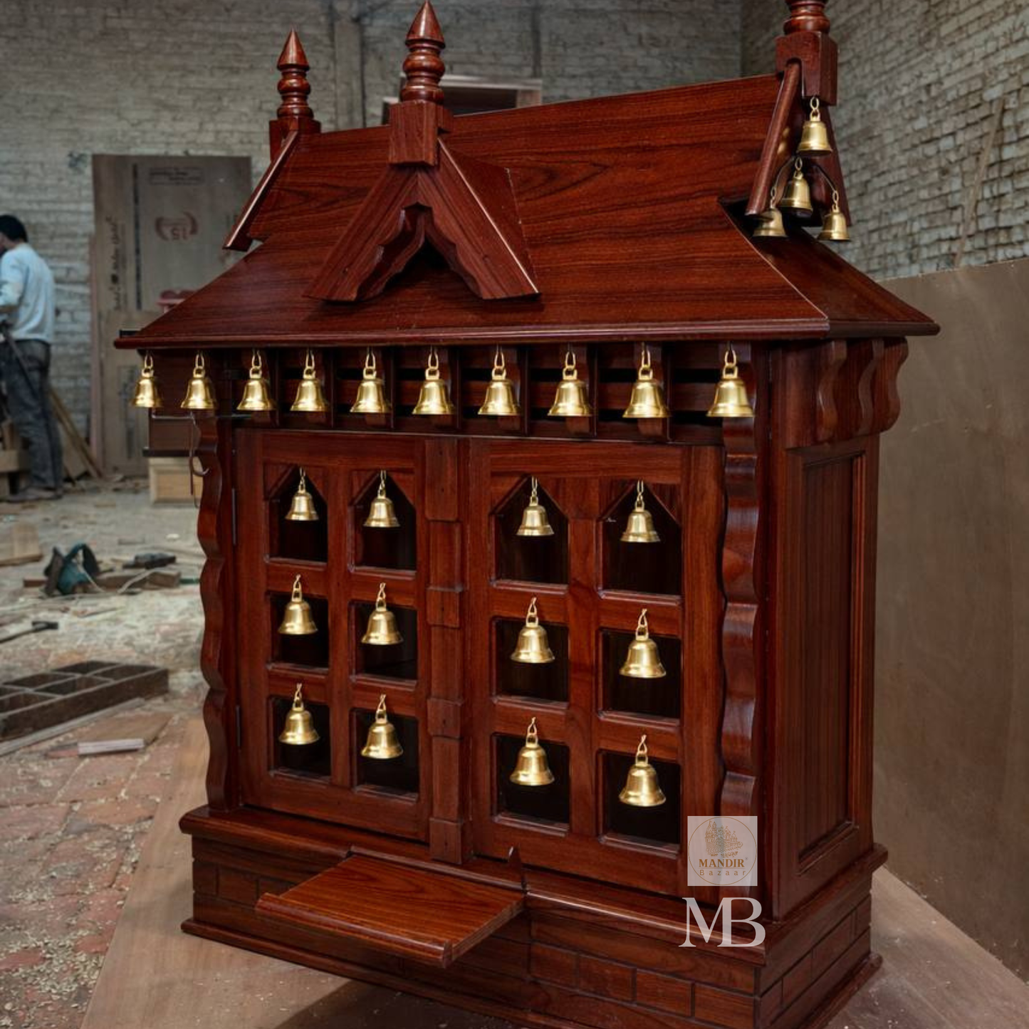 Side angle perspective view of mahogany finish Sheesham wood temple showing roof gables and kalash finials