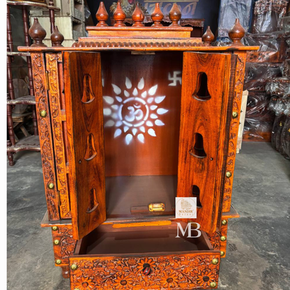 Decorative wooden bell mandir with intricate floral carvings for home