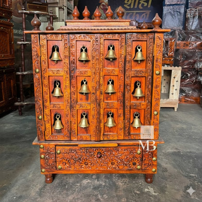 Hand carved wooden bell temple with traditional floral and ornamental carvings