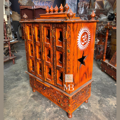 Wooden pooja mandir with carved storage drawer for prayer accessories