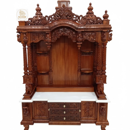 Wooden Ganesha pooja mandir with intricate traditional carvings