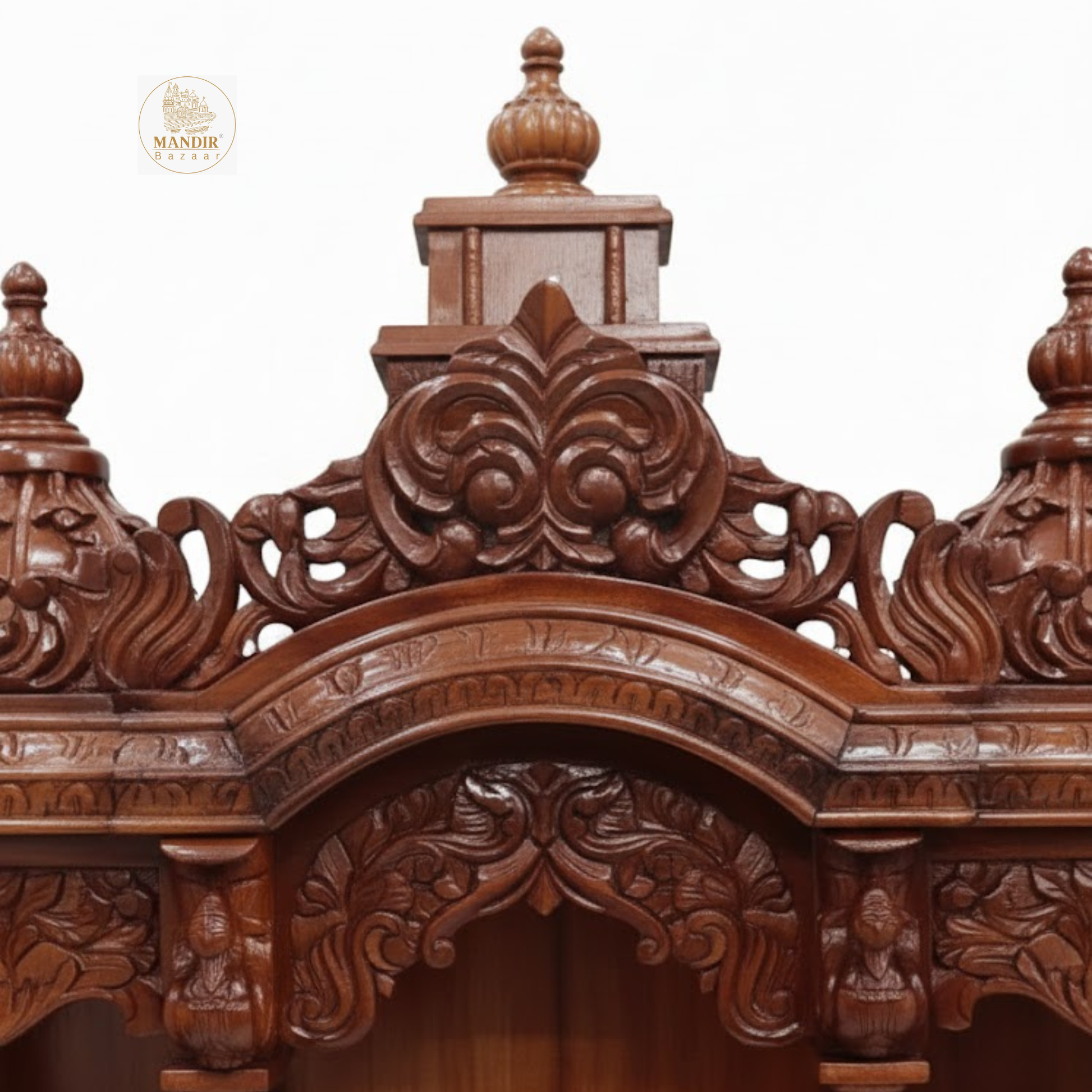 Handcrafted wooden mandir with detailed carved pillars and decorative arches