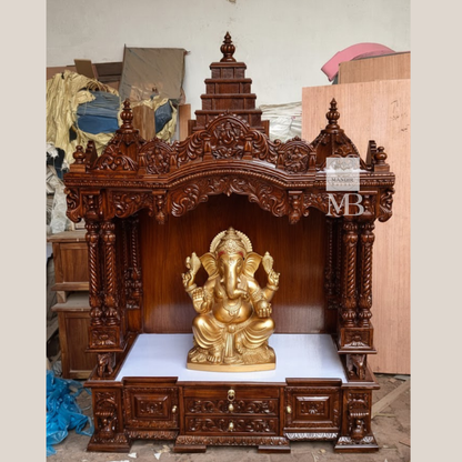 Hand carved wooden pooja mandir with traditional crown, Ganesha carving, ornate pillars, marble-look platform and storage drawers