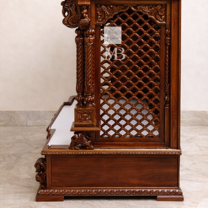 Hand carved wooden pooja mandir with traditional crown, Ganesha carving, ornate pillars, marble-look platform and storage drawers