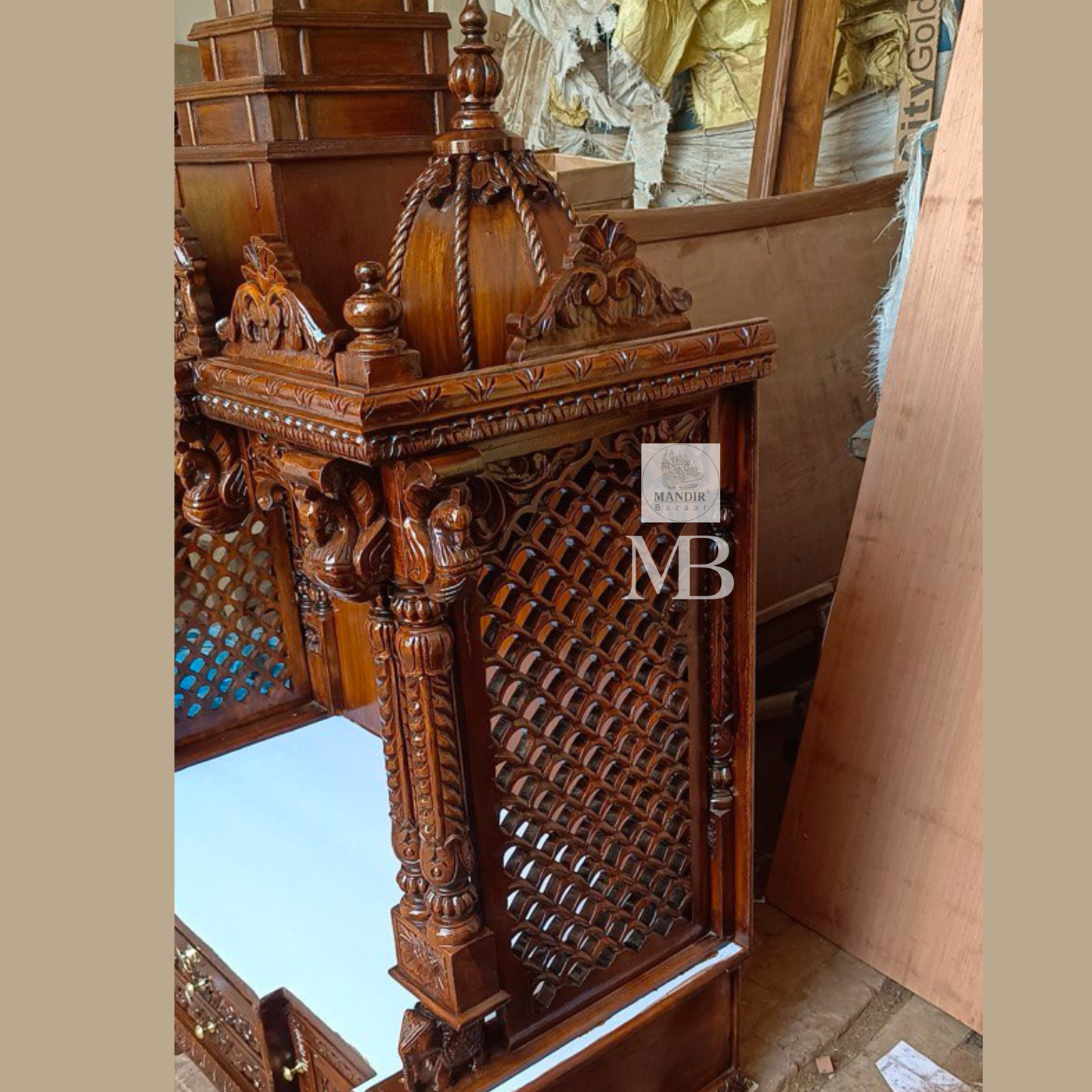 Hand carved wooden pooja mandir with traditional crown, Ganesha carving, ornate pillars, marble-look platform and storage drawers