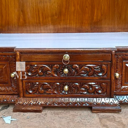 Hand carved wooden pooja mandir with traditional crown, Ganesha carving, ornate pillars, marble-look platform and storage drawers